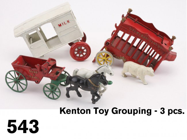 Kenton Toy Grouping - 3 pcs.: painted cast iron, includes Sand & Gravel dump wagon along with the back ends of a Milk wagon and Overland Circus cage wagon with polar bear Size: wagon 9.75" l.