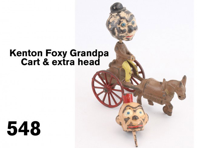 Kenton Foxy Grandpa Cart & extra head: painted cast iron circus parade toy featuring famous comic character Foxy Grandpa, also includes an extra head depicting Happy Hooligan Size: 12" t.