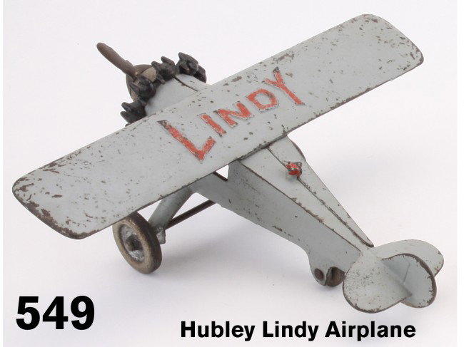 Hubley Lindy Airplane: painted cast iron floor toy, raised letters on wing celebrate the famed flyer, nickel plated wheels, a nice original example Size: 10" ws., 9.5" l.