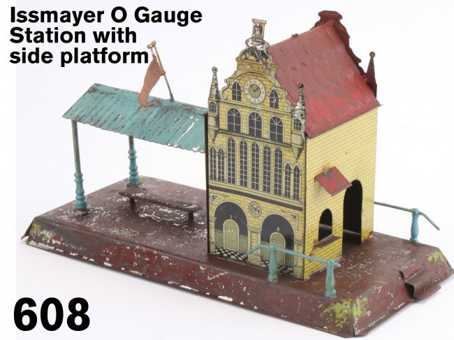 Issmayer O Gauge Station with side platform: hand painted and lithographed tin - typical finely detailed Issmayer lithography, an early piece circa 1895-1904 Size: 12" x 5.25" base
