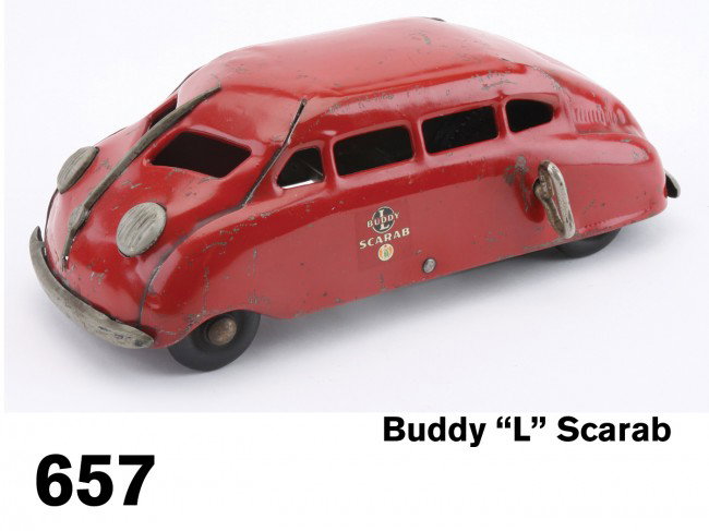 Buddy "L" Scarab: pressed steel, great 1930's streamlined design, clockwork mechanism with original decals, a better than average example with strong color and only moderate scuffing Size: 10.5" l.