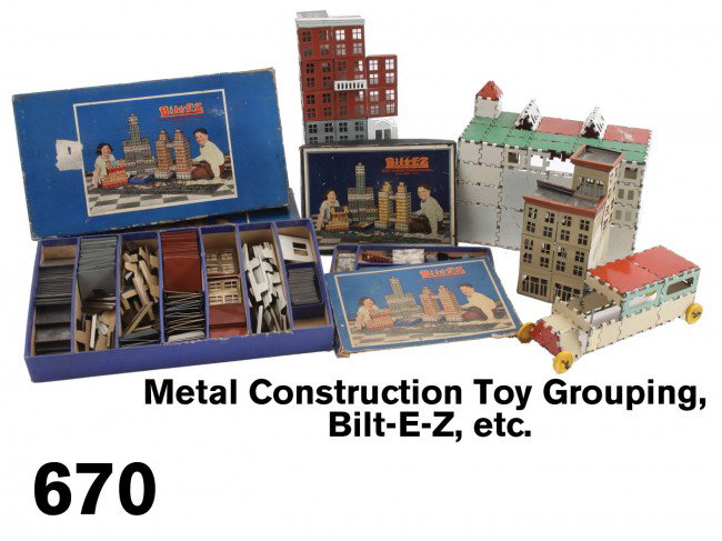 Metal Construction Toy Grouping, Bilt-E-Z, etc.: includes 4 Bilt-E-Z Building Sets: circa 1925 building sets comprised of painted tin panels with doors or windows along with molded cornice pieces to build all manner of building, in colorful illustra