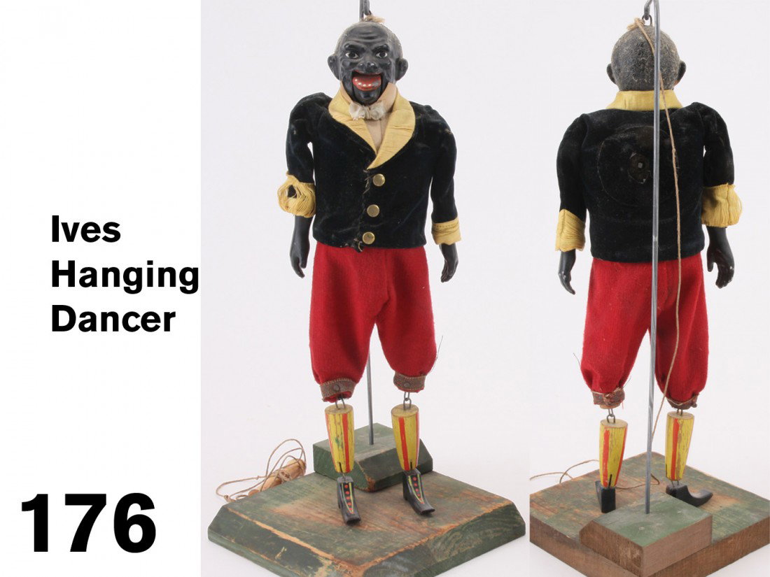 Ives Hanging Dancer: cloth dressed figure of various materials including cast metal head and hands and tin body housing robust clockwork mechanism which imparts dancing action to painted wood legs and feet and opening and