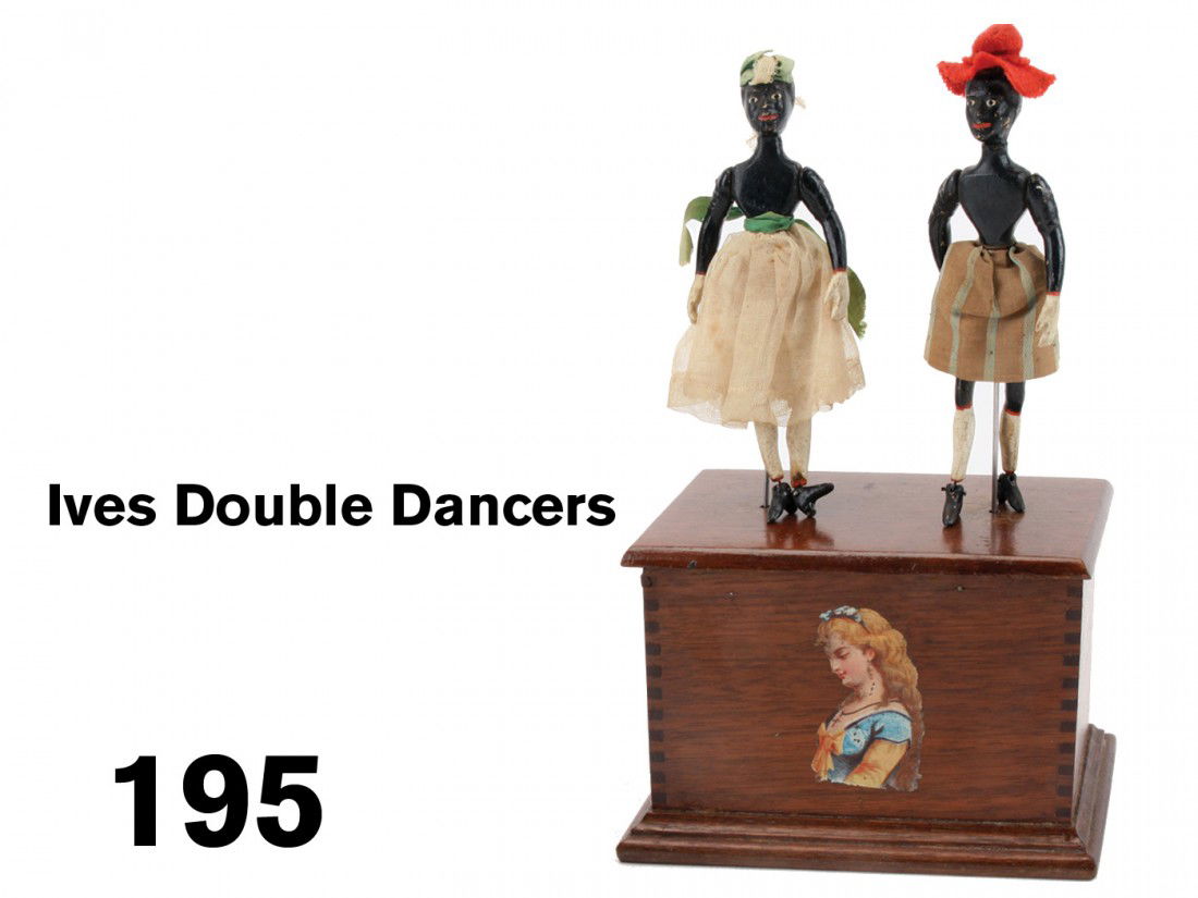 Ives Double Dancers: cloth dressed painted wood figures dance atop wood box which houses the clockwork mechanism, box retains its original colorful decorative decal;10" t.