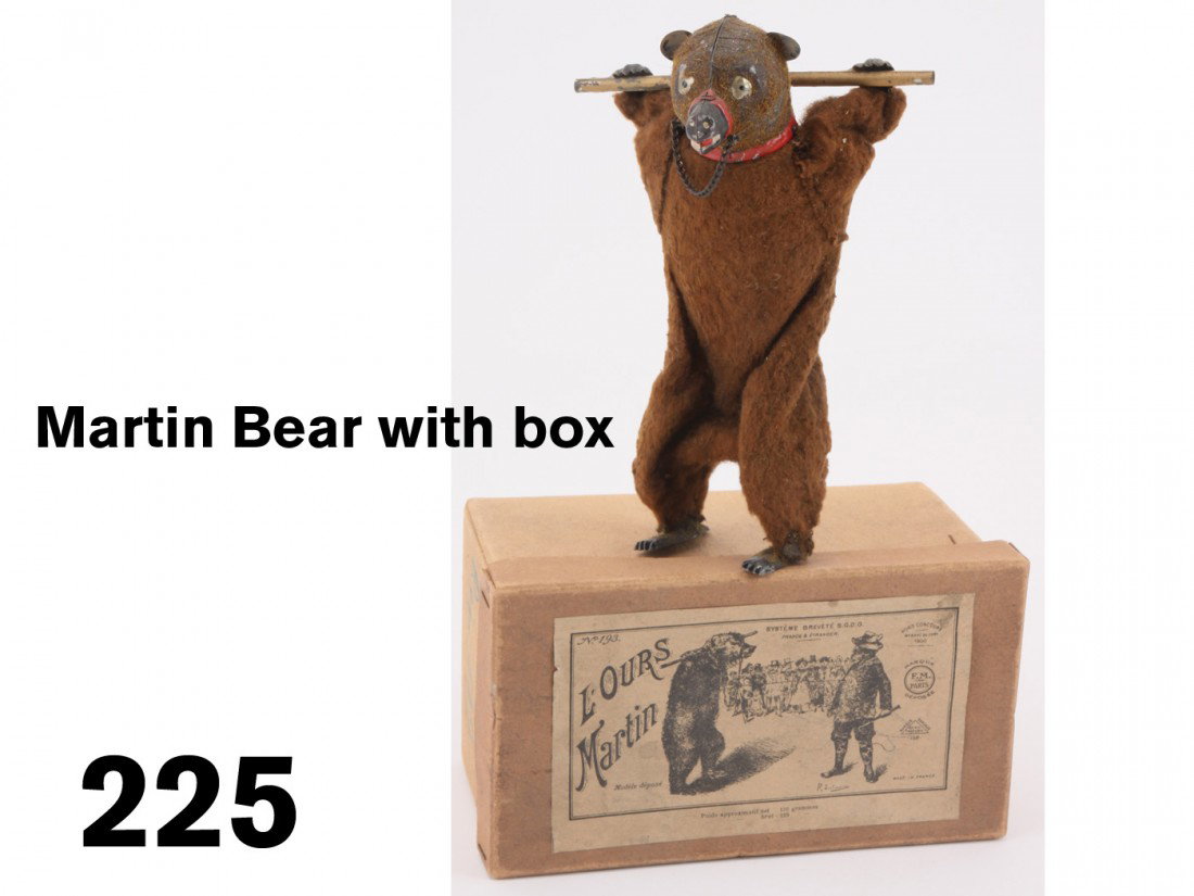 Martin Bear with box: cloth covered painted tin and cast metal with clockwork mechanism, this ursine performer by Martin is offered with original box with illustrative label;8" t.
