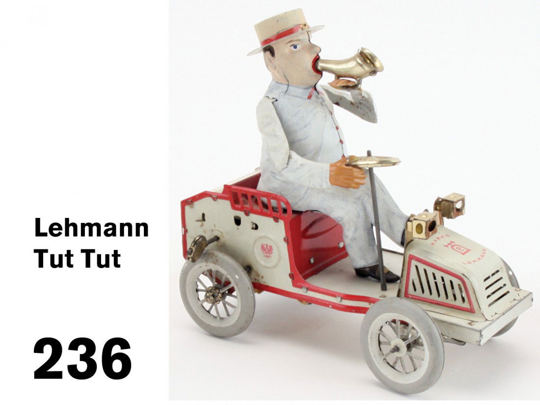Lehmann Tut Tut: painted tin clockwork toy; an exceptional example showing very little wear and retaining near perfect face paint, unstained metal horn, steering wheel and lights and functioning bellows;7" l.