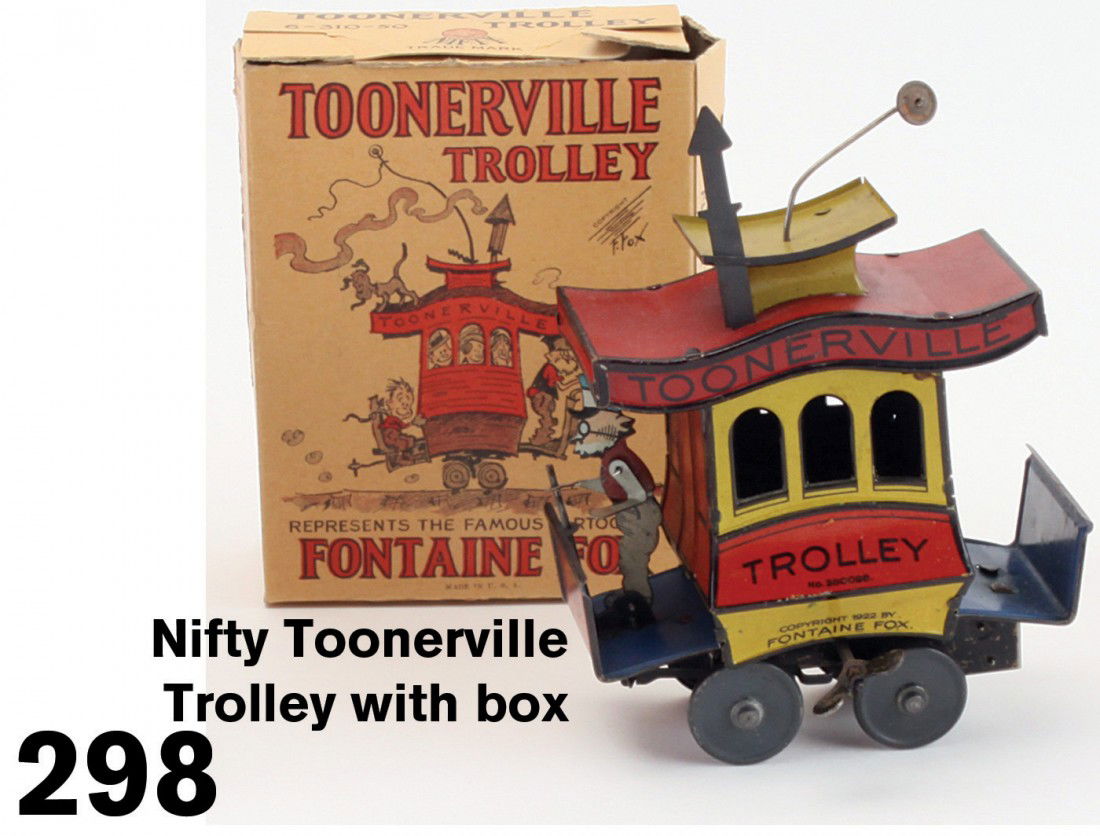 Nifty Toonerville Trolley with box: lithographed tin, clockwork, classic toy made in Germany for the American market to celebrate the famous Fontaine Fox comic strip; included with Dent Hardware Co. box;7" t.