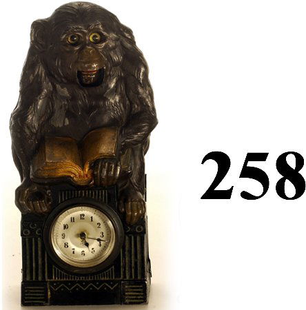 Monkey Moving Eye and Mouth Clock: Monkey Moving Eye and Mouth Clock cast metal face plate with tin back, made in Germany, beveled glass clock cover, subtle movement of eyes and mouth: eyes roll up and mouth opens 9.5" t. very good to