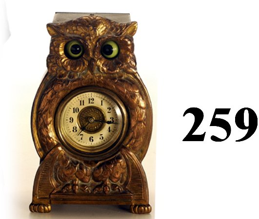 Owl Moving Eye Clock: Owl Moving Eye Clock cast metal face plate with wooden back, made in Germany, beveled glass clock cover, subtle movement of eyes - they alternately cross themselves the straighten out 6" t. excellent