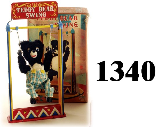 Y Teddy Bear Swing with box: Y Teddy Bear Swing with box lithographed tin battery operated cloth dressed bear 14"t. toy excellent ( very light scuffing), box good (torn corner,some denting and edge wear) * A special note regardin