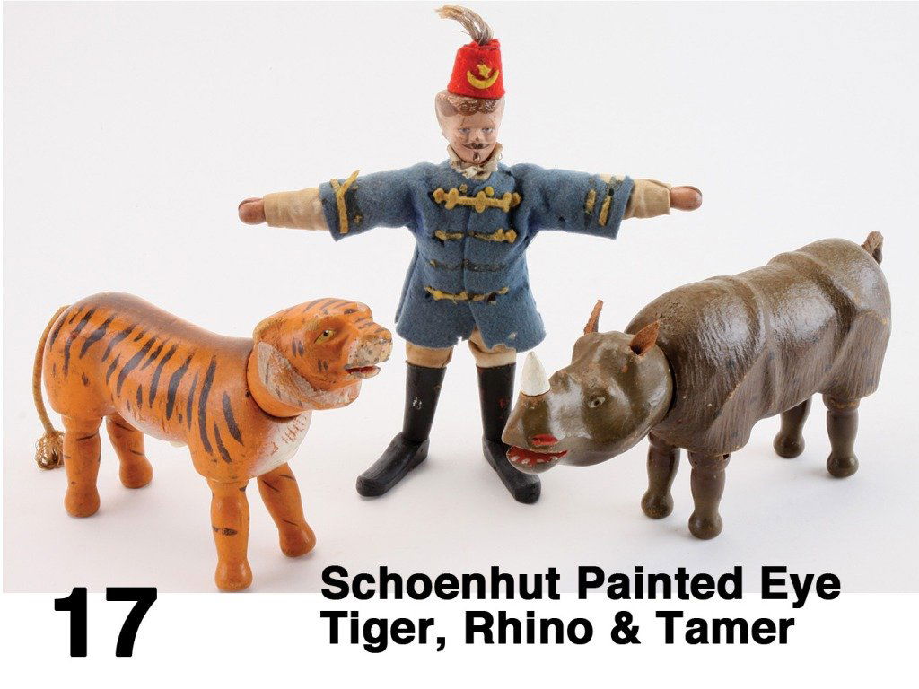 Schoenhut Painted Eye Tiger, Rhino & Tamer: painted wood jointed animals; tiger with molded ruff; rhino with leather ears and cord tail (replaced horn) along with cloth dressed lion tamer (replaced feet and boot tops) Size: rhino 9.5" l. (not i