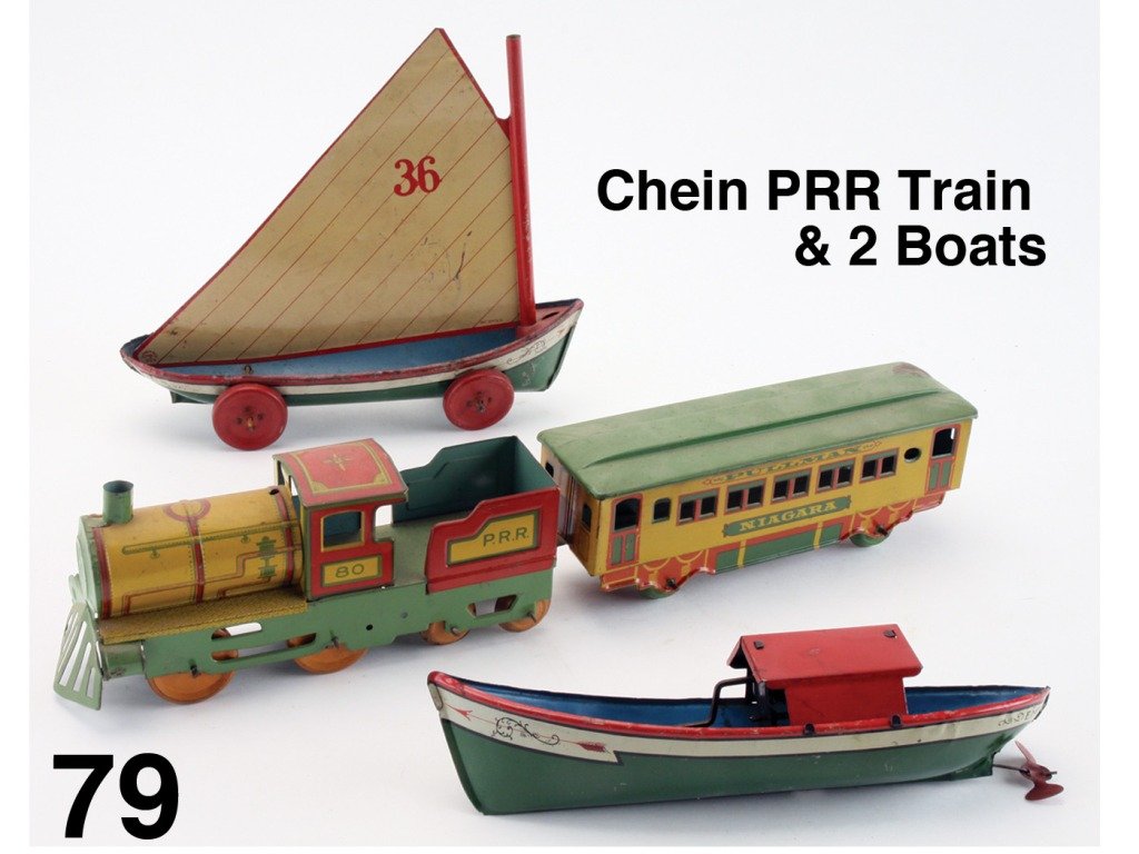 Chein PRR Train & 2 Boats: lithographed tin; train and Ruth sailboat are floor toys while the Emma launch is a water toy with clockwork mechanism Size: train 18" l., boats 10" l.