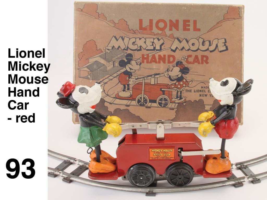 Lionel Mickey Mouse Hand Car - red: No. 1100 painted tin clockwork handcar with composition Mickey & Minnie, full circle of track in original illustrated box; very nice, clean example Size: car 7.5" l.
