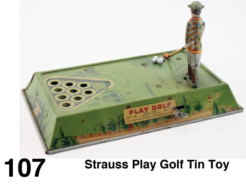 Strauss Play Golf Tin Toy: lithographed tin clockwork, clever action and a colorful toy - golfer swings and hits balls into holes which automatically return for player to swing again Size: 12" x 7"