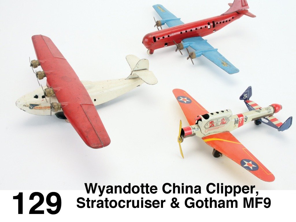 Wyandotte China Clipper, Stratocruiser & Gotham MF9: painted pressed steel 4 prop planes with wooden wheels along with Gotham Pressed Steel with pull lever shooter Size: ws. 13" each.