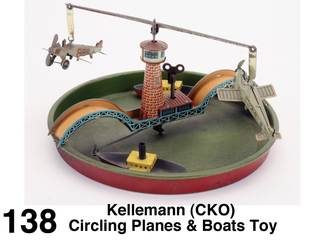 Kellemann (CKO) Circling Planes & Boats Toy: lithographed tin with clockwork mechanism - planes circle in one direction and the boats in another; planes marked 227 with makers emblem Size: 8.5" diam. x 4.5" t.