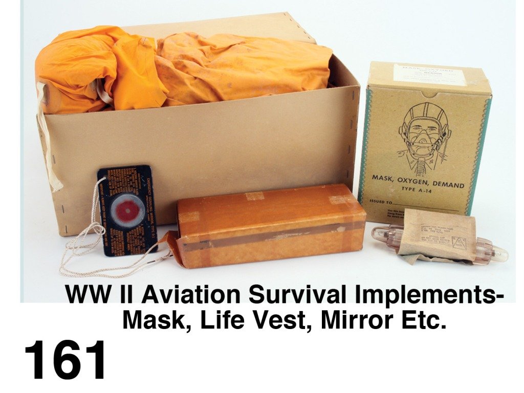 WW II Aviation Survival Implements-Mask, Life Vest, Mir: World War II aircraft Mask ; Oxygen Type A-14 in original box with paper label dated 1944 by The Ohio Chemical & Mfg. Co., unlabeled life vest kit, a Martin-Bake survival tin embossed 'Universal compo