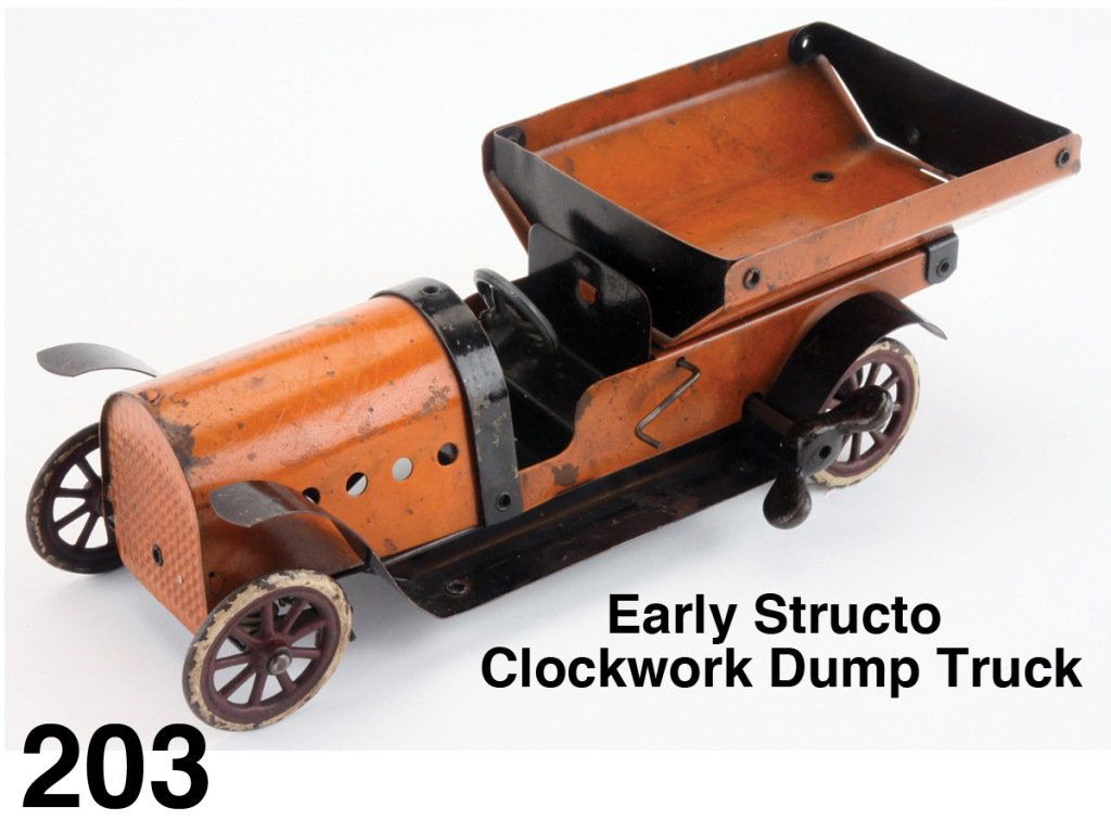 Early Structo Clockwork Dump Truck: painted pressed steel clockwork truck with dump lever Size: 12" l.