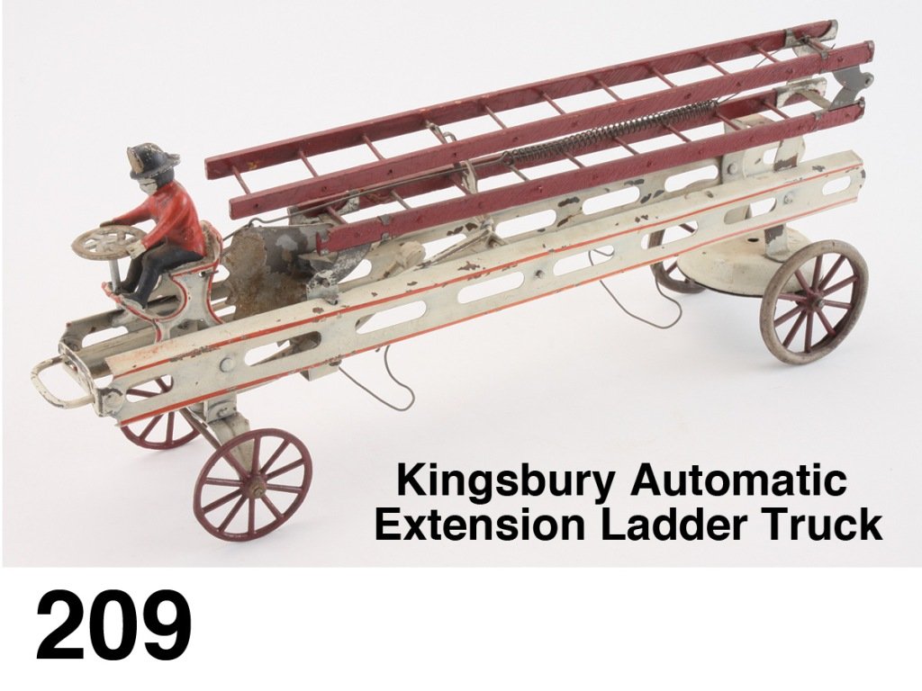 Kingsbury Automatic Extension Ladder Truck: pained heavy steel and wood, integral cast iron driver in seat, clockwork mechanism under rear wheels (missing winder); clever operation - when truck hits obstruction thus pushing in front wire bumper