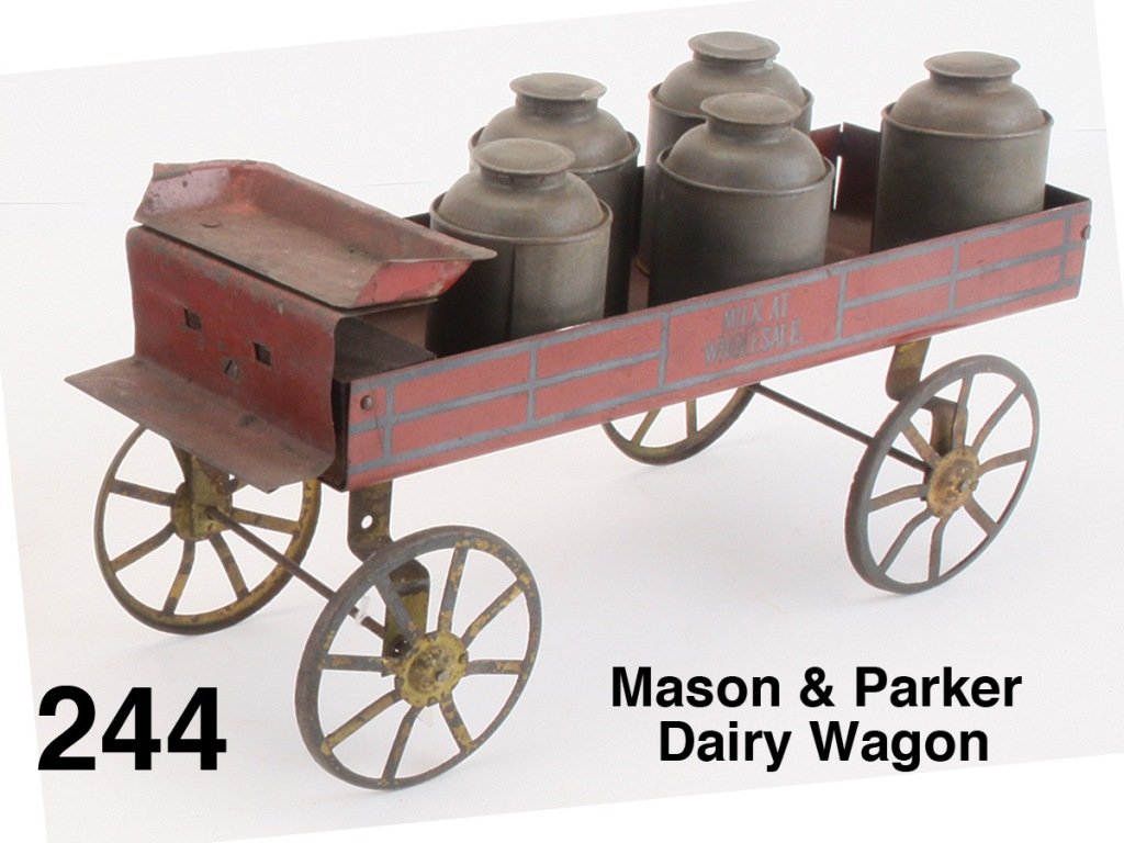 Mason & Parker Dairy Wagon: painted steel marked "Milk at Wholesale" on either side and 5 tin milk cans Size: 14" l.