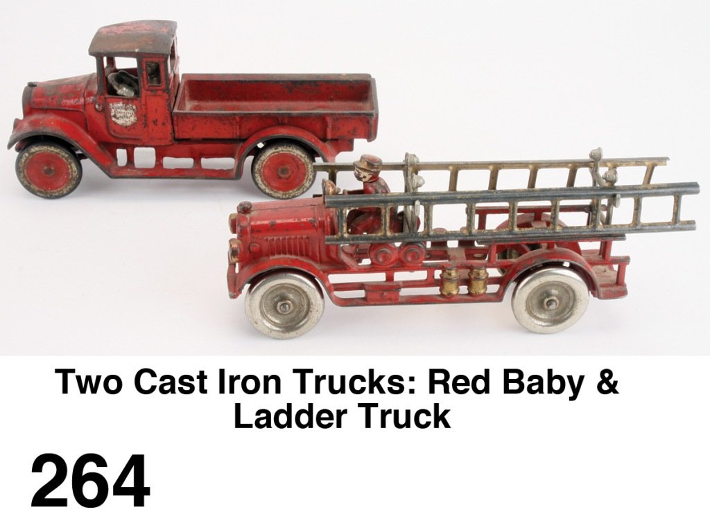 Two Cast Iron Trucks: Red Baby & Ladder Truck: painted cast iron with nickel plated wheels, includes Arcade International flat bed truck with driver along with a Kenton ladder truck with ladders and integral cast river Size: appr. 10" l. each