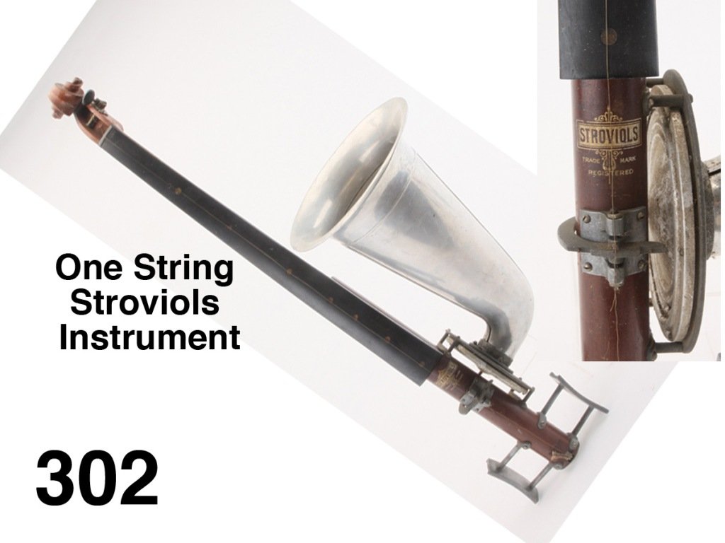 One String Stroviols Instrument: this rare and unusual musical instrument has a one stringed neck and large attached trumpet-shape aluminum horn, it retains original decal Stroviols Trade Mark decal; this English made instrument was 