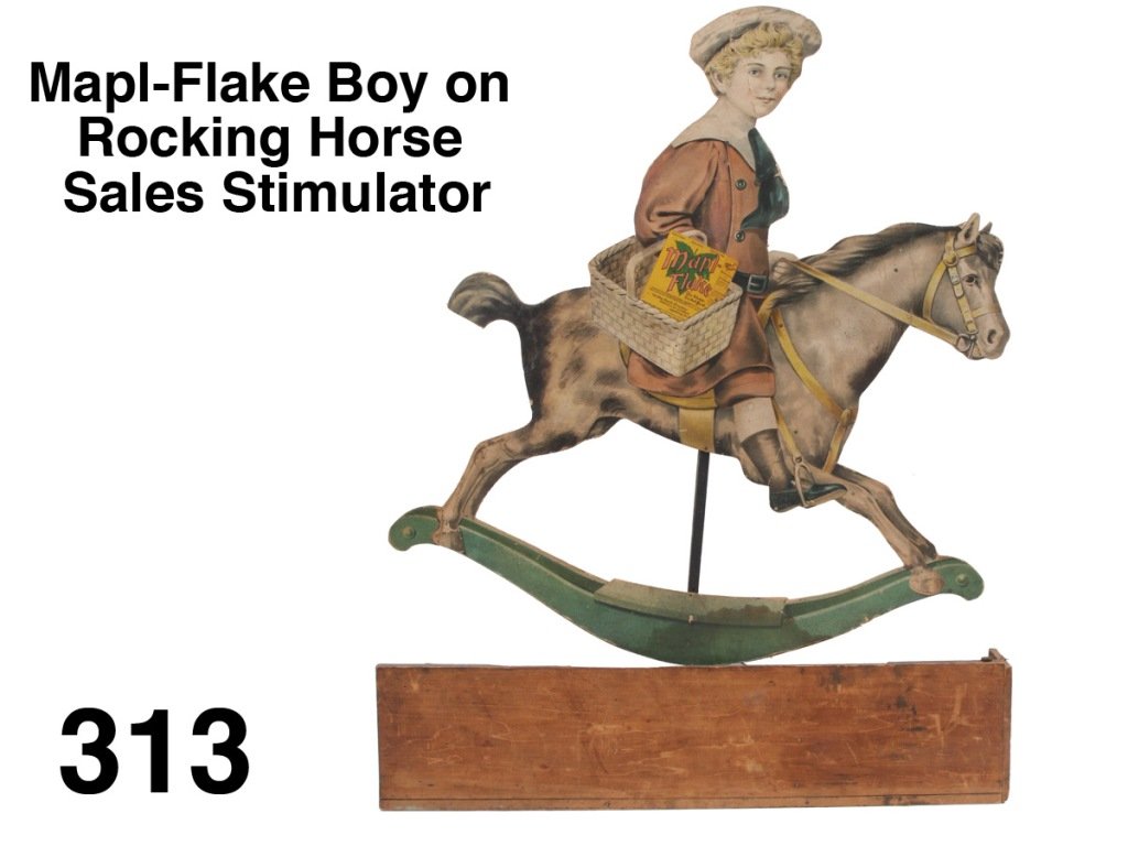 Mapl-Flake Boy on Rocking Horse Sales Stimulator: lithographed cardboard clockwork sales stimulator, robust clockwork mounted on reverse keeps this guy rocking' in the store window - he is holding a box of Mapl-Flake cereal Size: 36" t., 28" w.
