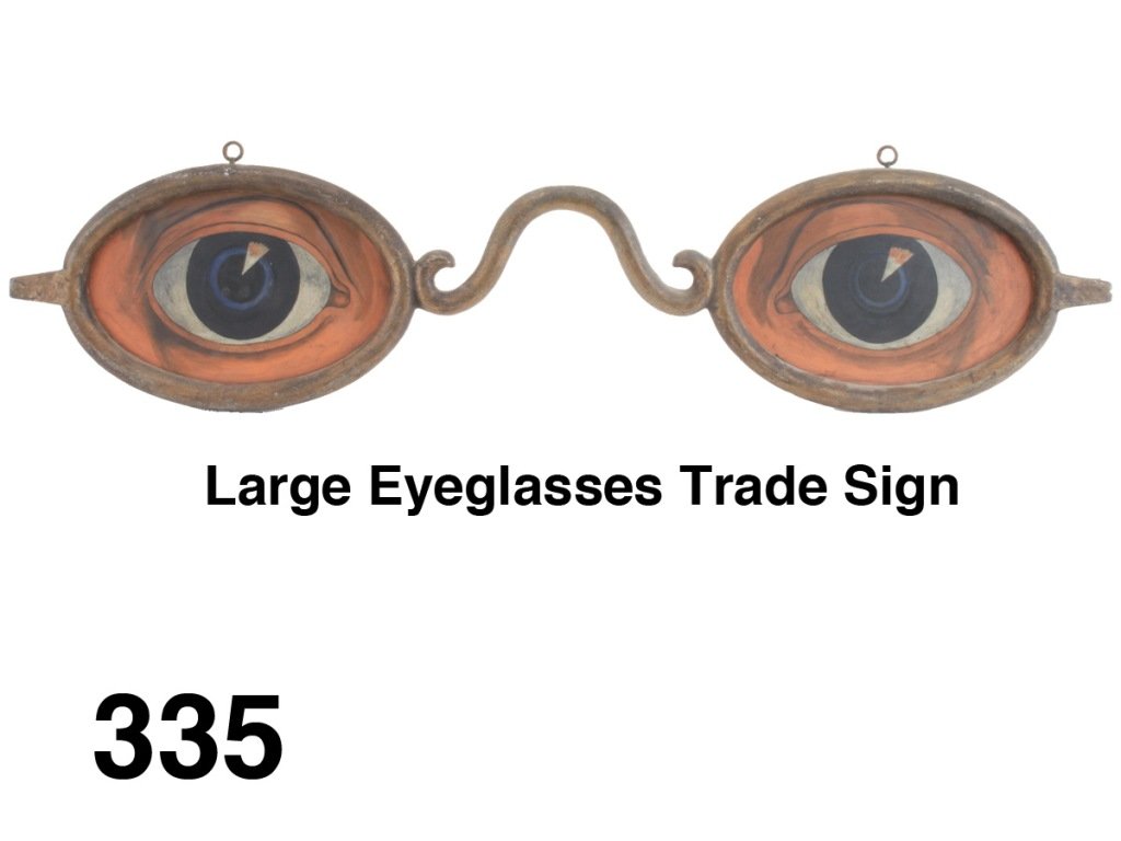 Large Eyeglasses Trade Sign: gold painted cast zinc frame with hanging eye hooks and realistically painted tin eye inserts, a classic American trade sign form Size: 35" l.