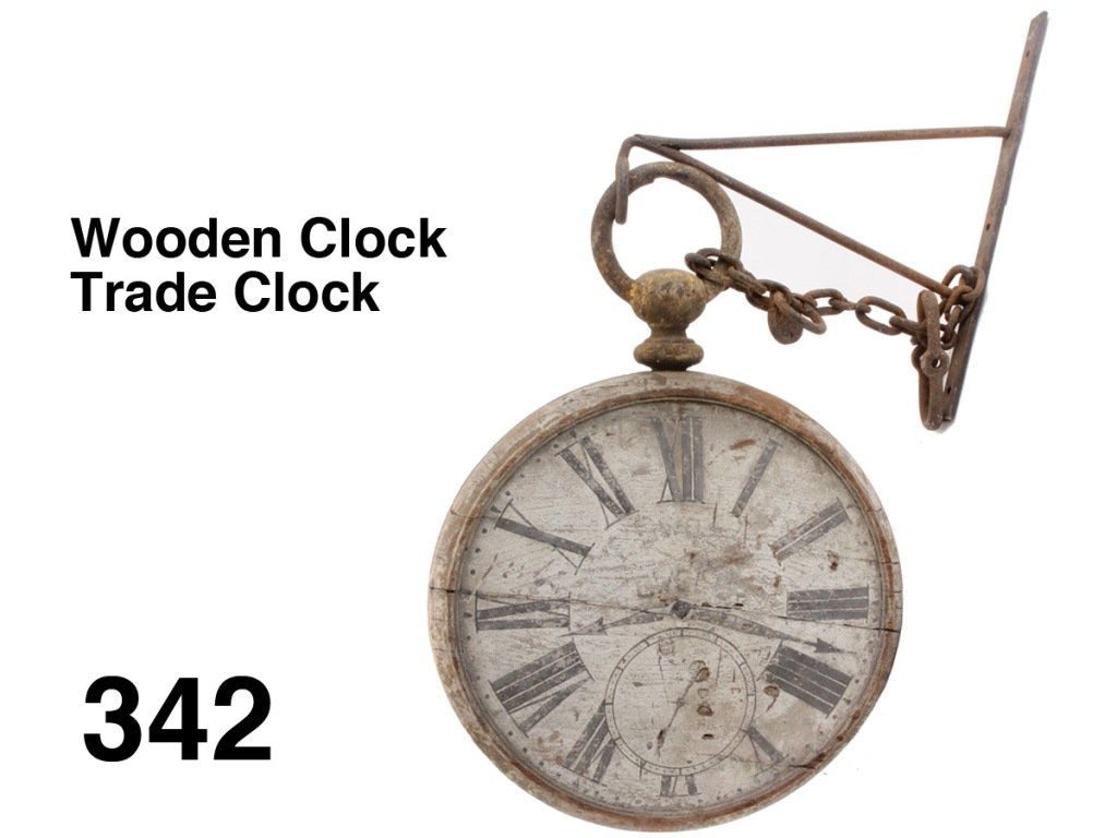 Wooden Clock Trade Clock: painted wood pocket watch form trade sign with gold painted cast iron stem and bow; offered with original heavy iron hanging bracket and cast iron watch chain; one face is nicely worn original paint w