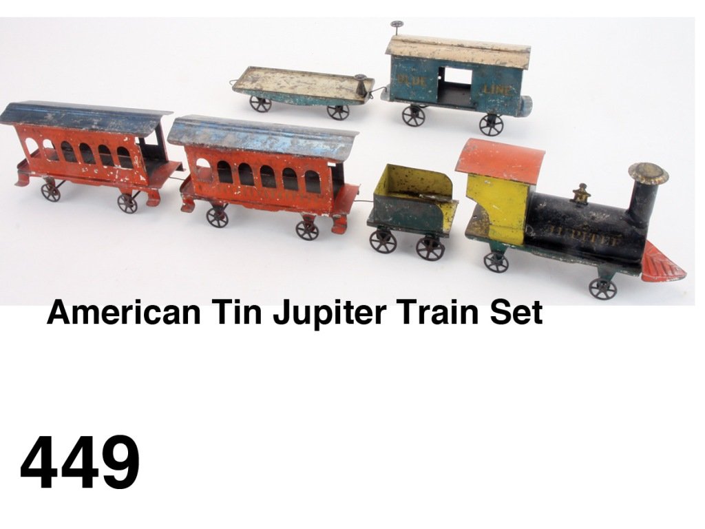 American Tin Jupiter Train Set: painted tin 6 piece freight set with loco, tender, flat car, "Blue Line" box car and 2 "Central R.R." passenger coaches embossed with patent date of Feb 27th 1883 on bottom Size: appr 40" l.