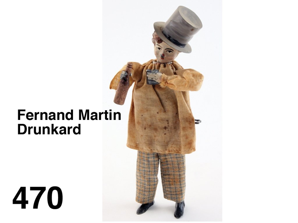 Fernand Martin Drunkard: cloth dressed painted tin and lead figure with internal clockwork mechanism, he holds wood bottle and metal cup, he pours and drinks as he stumbles along Size: 8" t.