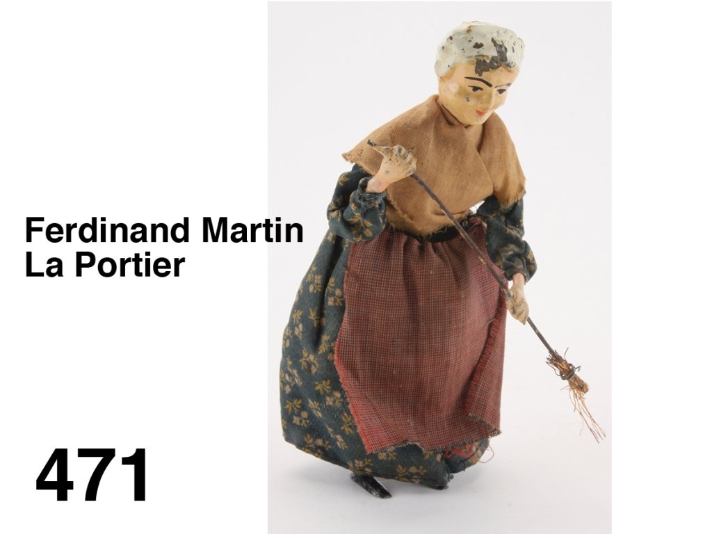 Ferdinand Martin La Portier: cloth dressed painted tin toy with internal clockwork mechanism, retains very nice paint on face, a scarce Martin toy Size: 7" t.