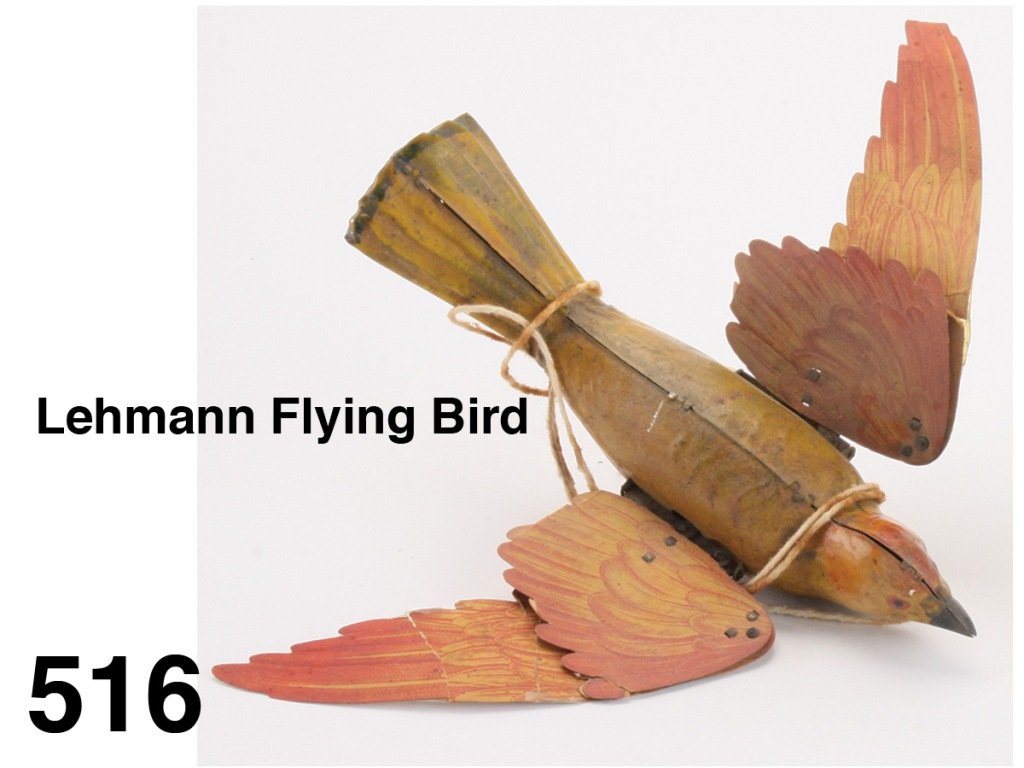 Lehmann Flying Bird: painted tin with lithographed paper wings, when fully functional would flap wings as it proceeded along string Size: 7" l.