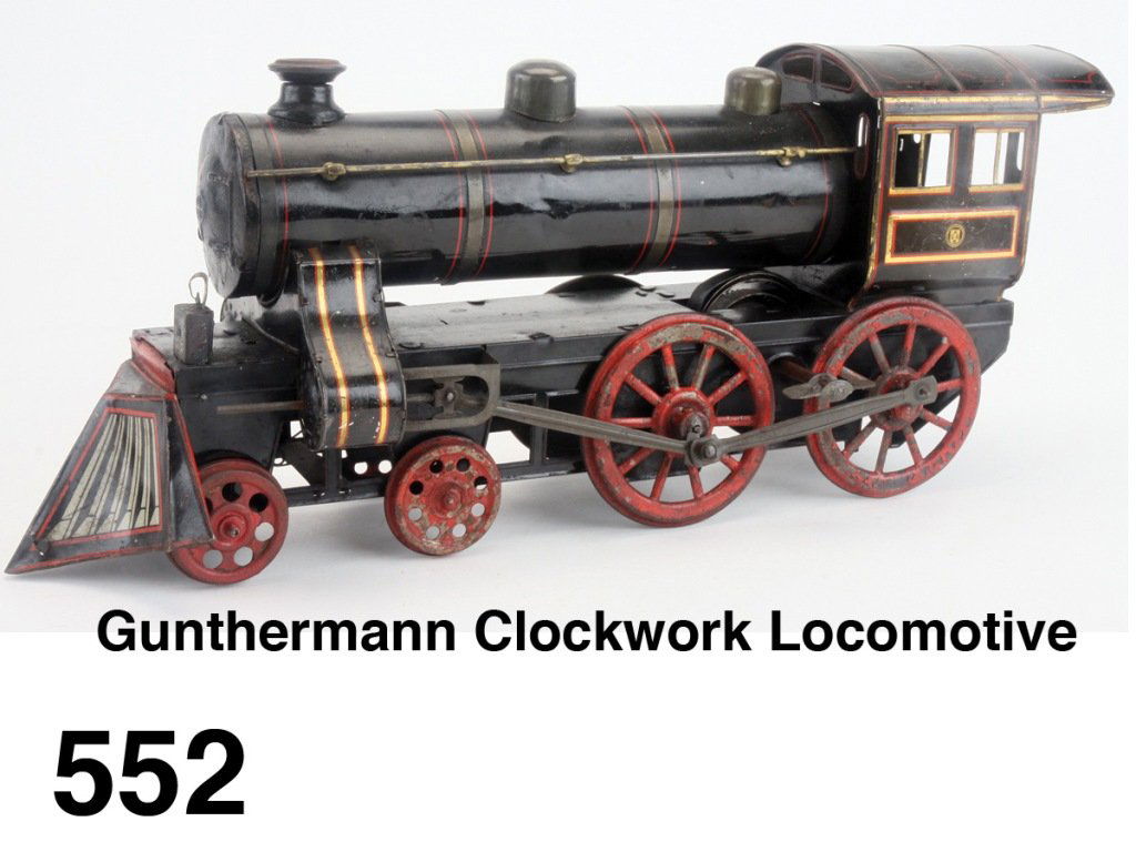 Gunthermann Clockwork Locomotive: German lithographed and painted 4-4-0 clockwork loco Size: 16.5" l.