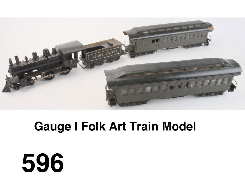 Gauge I Folk Art Train Model: amazingly detailed hand crafted train including tender, combination car, and passenger coach; obviously inspired by a Marklin train - the loco has what appears to be a Marklin clockwork motor - fully