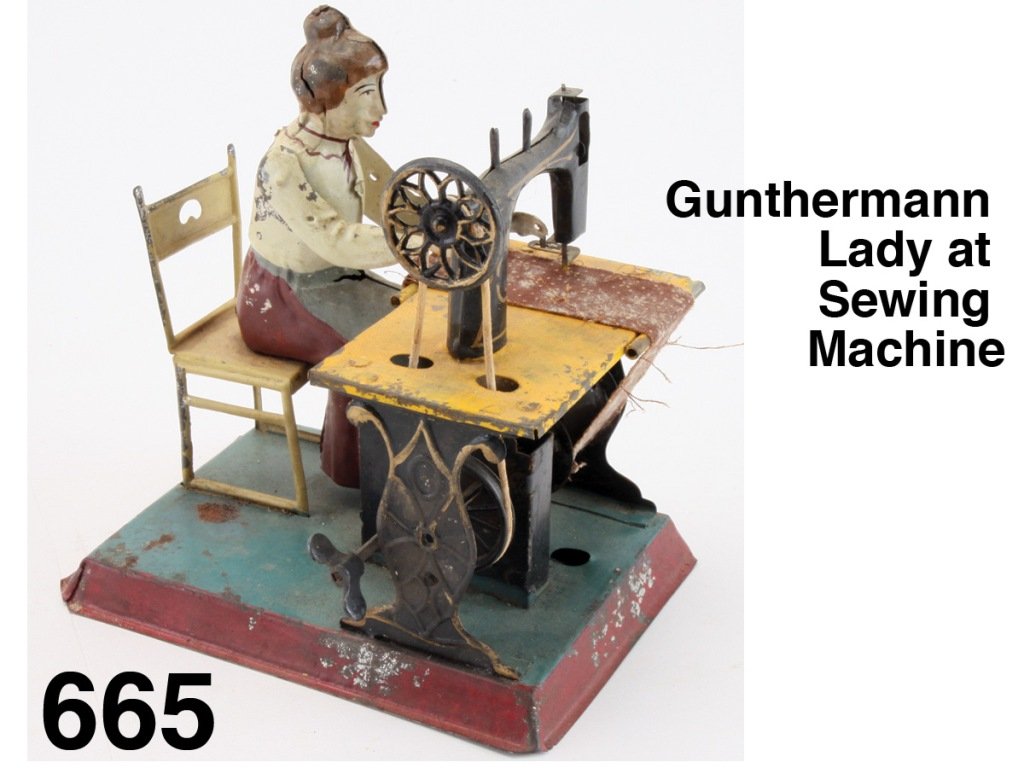 Gunthermann Lady at Sewing Machine: painted tin figure sits at sewing machine, clockwork mechanism activates machine while fabric passes beneath her hands, a scarce Gunthermann in above average condition Size: 5.5" t.