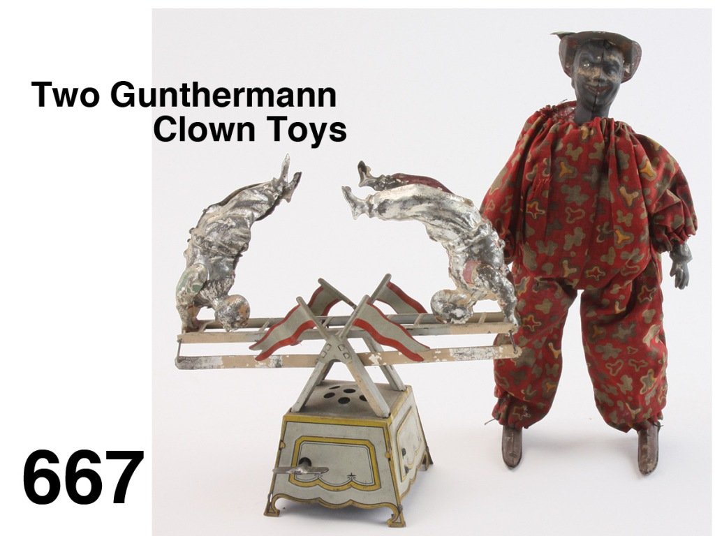 Two Gunthermann Clown Toys: both clockwork, includes painted tin clown acrobats on lithographed seesaw base (serious paint loss, 1 figure bent and dented) along with a cloth dressed clown with internal clockwork: he spreads legs