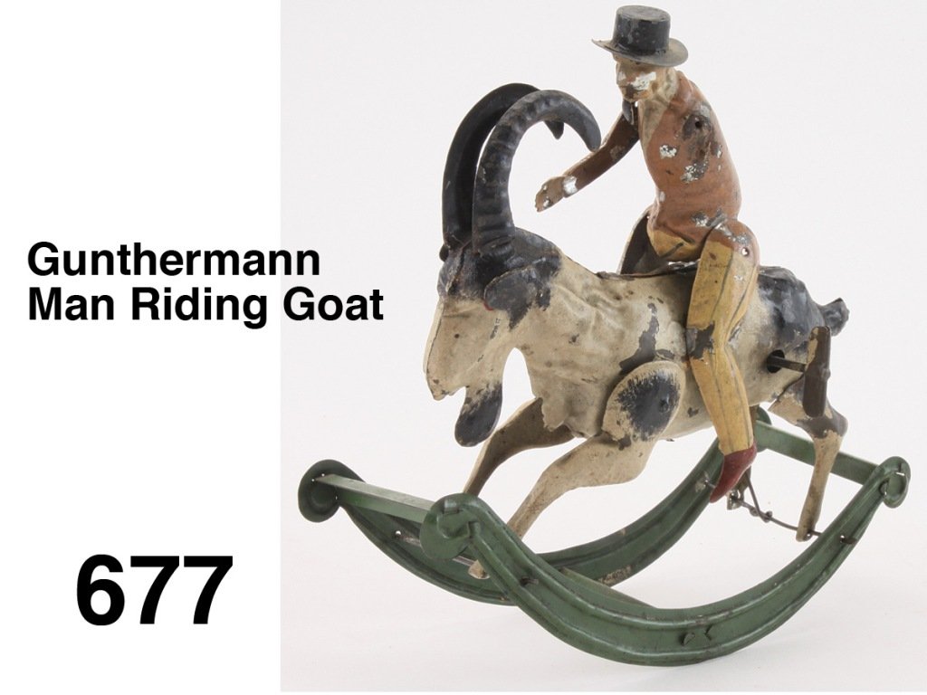 Gunthermann Man Riding Goat: painted tin, man in stripped pants and wearing a hat is riding a goat rocking horse which house clockwork mechanisms Size: 7" l.