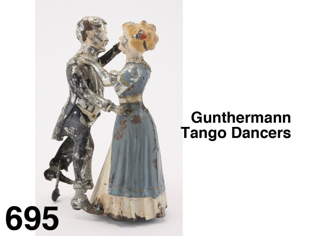 Gunthermann Tango Dancers: painted tin couple, lady figure encloses the clockwork mechanism that propels them back and forth Size: 7.5" t.