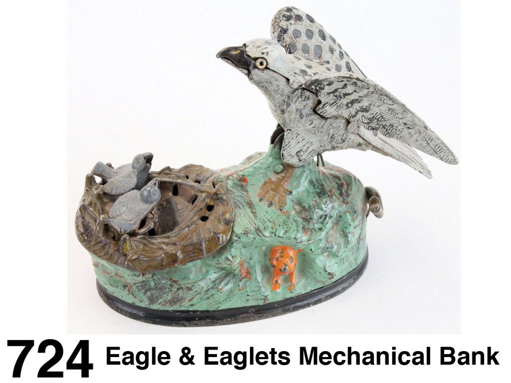 Eagle & Eaglets Mechanical Bank: painted cast iron, made by J. & E. Stevens, complete with operational bird chirping bellows (broken wing on an eaglet) Size: 6.75" l.