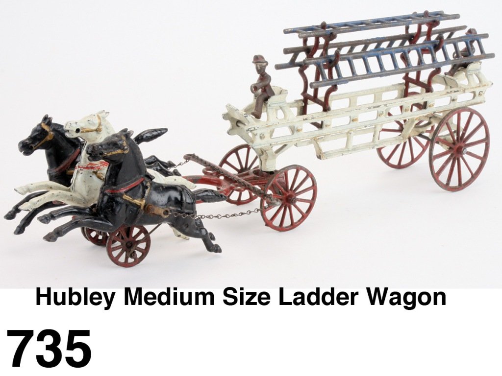 Hubley Medium Size Ladder Wagon: painted cast iron with 3 horses, retains original driver, 3 ladders and ladder supports Size: 19" l.