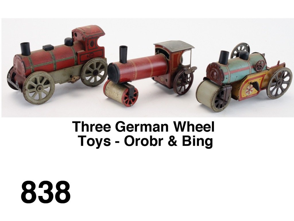 Three German Wheel Toys - Orobr & Bing: lithographed tin windups, includes Orobr roller and Locomotive along with a Bing Road Roller Size: 6" l.