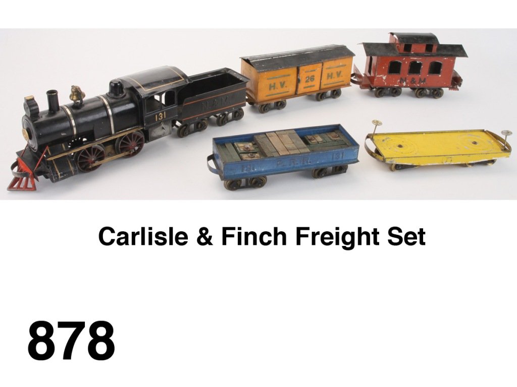 Carlisle & Finch Freight Set: painted tin American steam profile 0-4-0 electric 131 locomotive and N. & M. tender (very good to excellent) and 4 freight cars - H.V. 26 box car, 171 flat car, 131 P.R.R. gondola with track blocks an