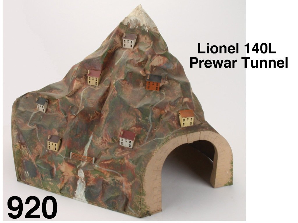 Lionel 140L Prewar Tunnel: hand painted standard gauge metal tunnel with seven chalet styled houses, bridge railing and electric interior lights Size: appr. 37.75" l. x 20.5" at widest point and 22.75" t.