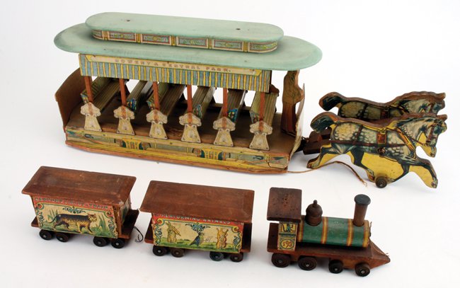 Bliss Horse Drawn Street Car & Circus Train: colorful lithographed paper on wood trolley drawn by 2 horses, retains original conductor and all the reversible seat backs and side curtains, destinations noted are Bowery and Central Park, the horse