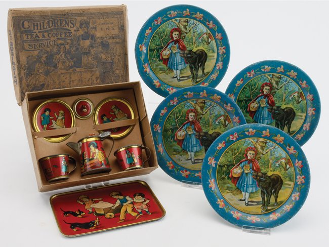 Childs' Tin Tea Set: lithographed tin 9 piece children's tea and coffee service in original illustrated box along with 4 Ohio Art Little Red Riding Hood plates box 7" x 5.5"