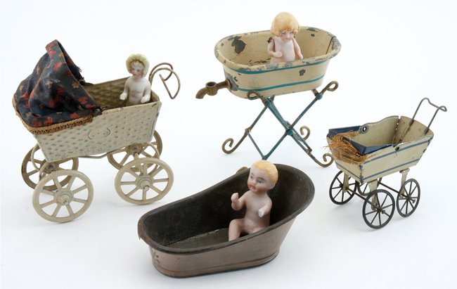 Bisque Dolls, Carriages & Wash Tubs: painted tin grouping includes 2 carriages, 2 bathing tubs and 3 painted bisque children (1 child missing arm) tub with stand 3.5" t. x 4" w.