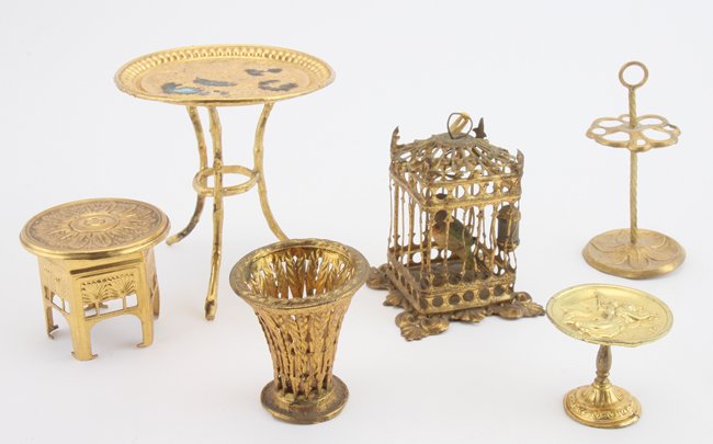 Erhard & Sohne Dolls' House Accessories: ormolu grouping includes waste paper basket, umbrella stand, small table, pedestal bowl, tray table and square form bird cage (missing 1 feeder, bending to some bars) table 3" t. cage 2.25" t.