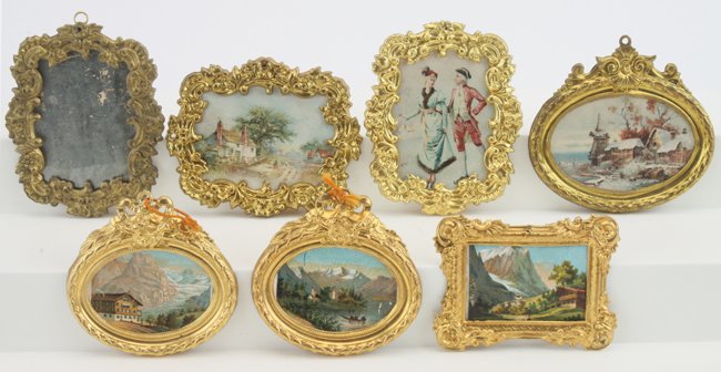 Seven Erhard & Sohne Frames: ormolu and gilt framed grouping includes a mirror and 6 various oval and rectangular framed images of scenic views and a young couple ice skating larger 3.25" x 3"