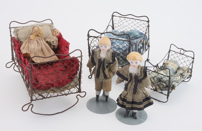 Twin Parian Dolls with Beds: two matching painted bisque shoulder head children with bisque lower arms and legs wearing very nice original sailor outfits along with 3 wire form cradle beds (possibly Ladies Guild/Ragged Girls Scho